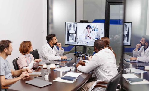 1. Feature image- A diverse team collaborating via video conferencing in remote and hybrid project environments (3).jpg